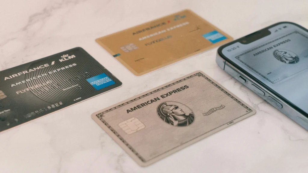 A traveler using an American Express card in an airport lounge