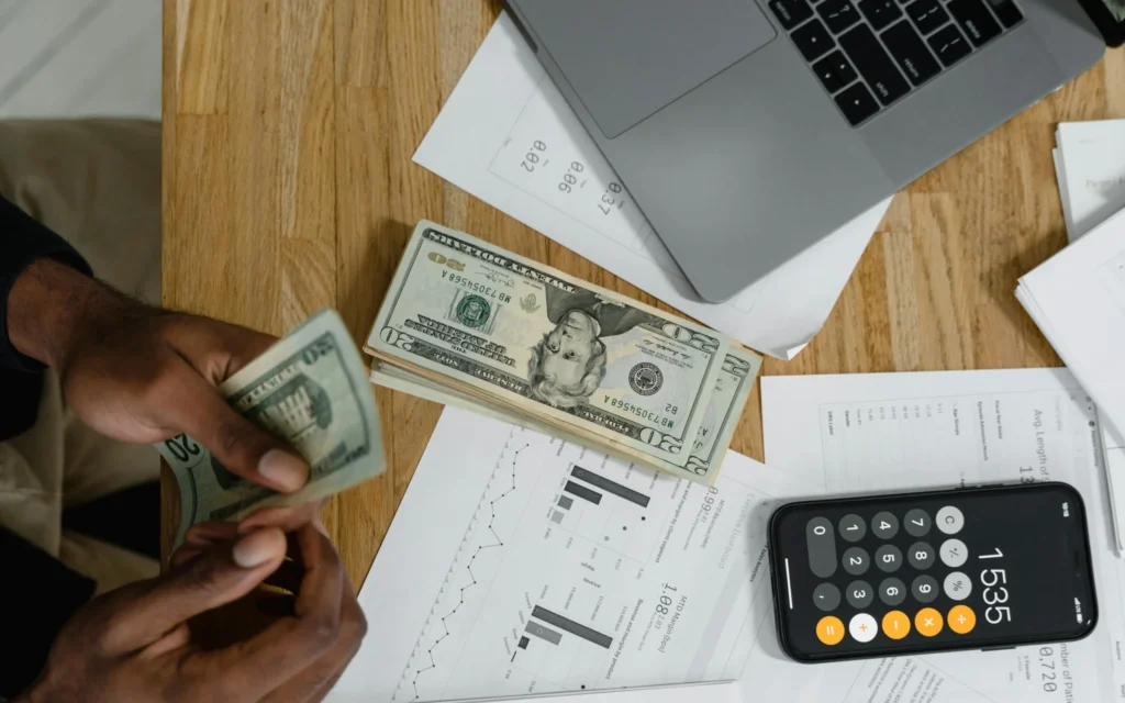 A person counting his saving
